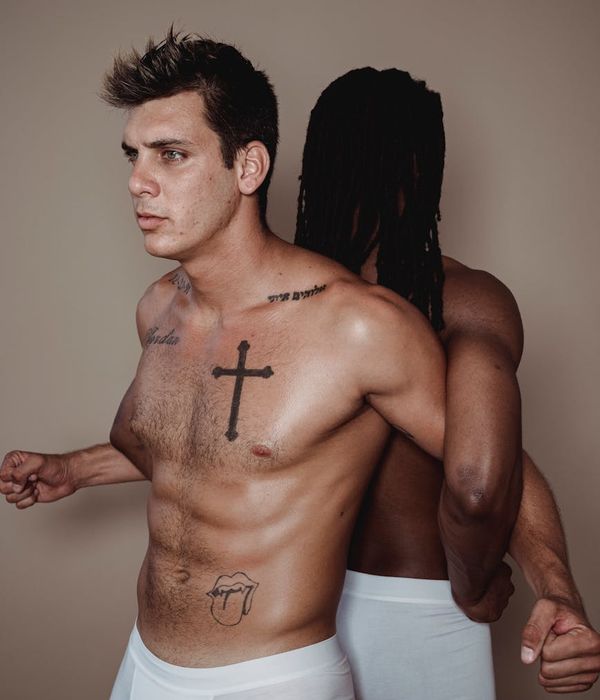 Man performing a strength exercise in a clean, minimalist gym setting.